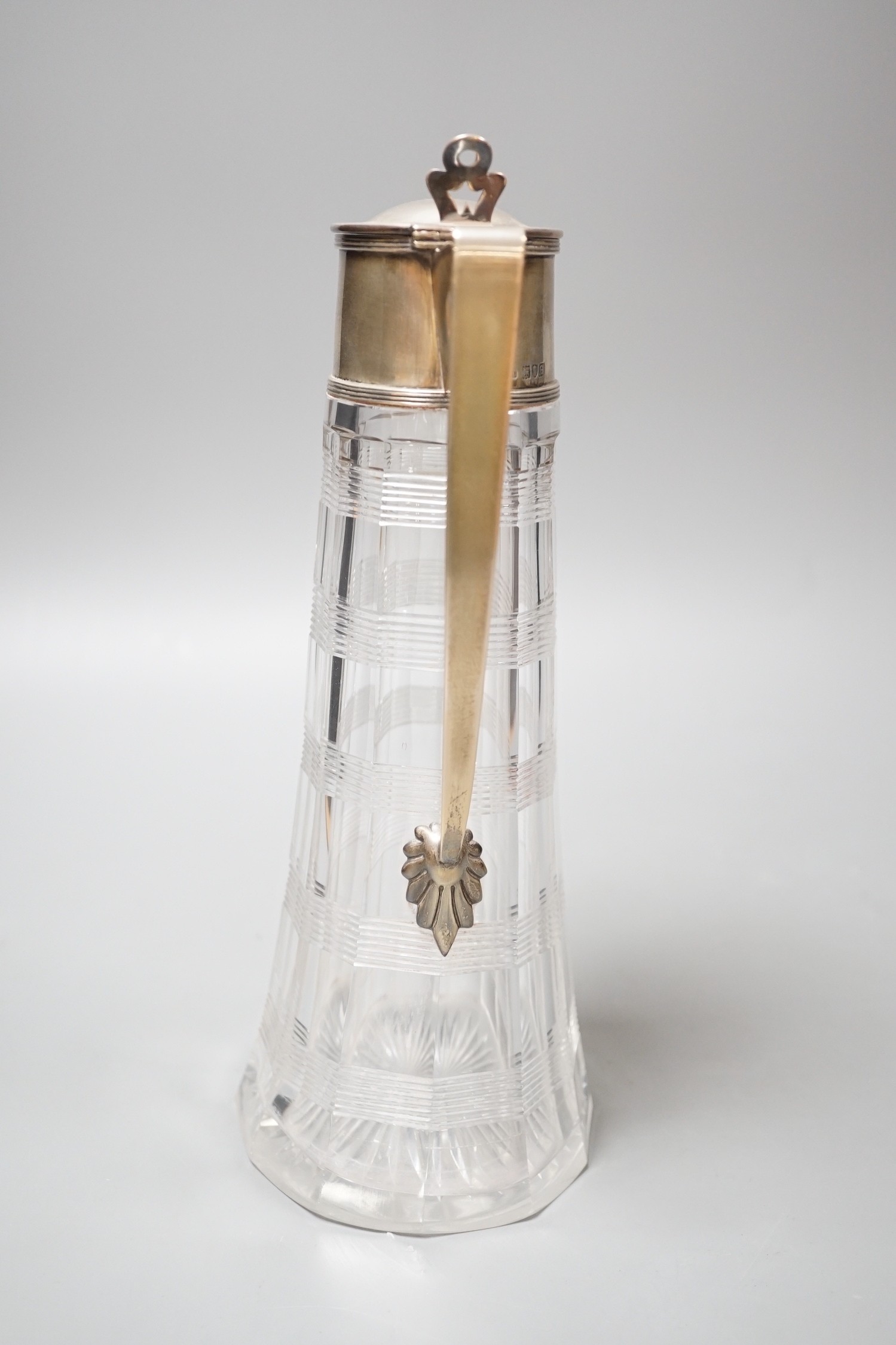 A late Victorian silver mounted cut glass claret jug, with reeded bands, John Grinsell & Sons, London, 1900, 26.5cm.